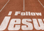 I Follow Jesus written on running track, New Concept on running track text in white color